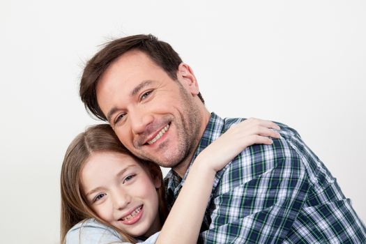 Father and daughter giving himself a hug