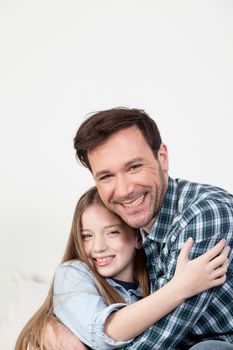 Father and daughter giving himself a hug