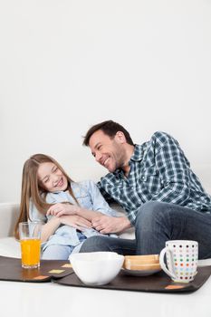 Father and daughter giving himself a hug