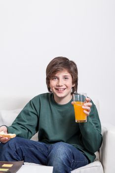 Boy holding a orange juice