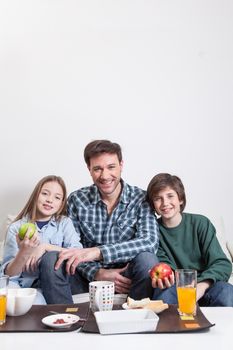 Man having a breakfast with your two childrens