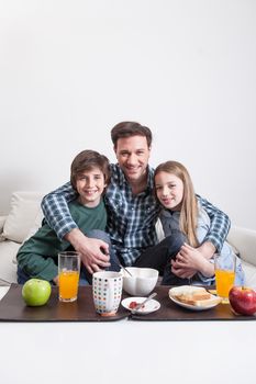 Man having a breakfast with your two childrens