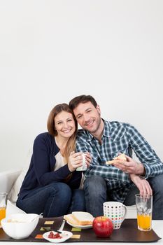 Couple smiling having a breakfast