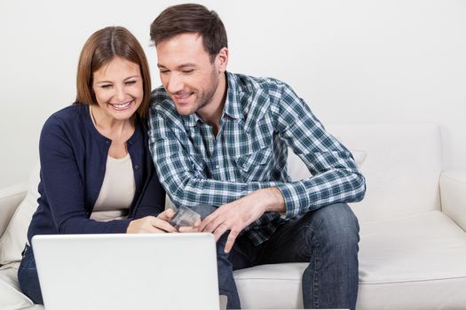 Beautifull couple using the computer