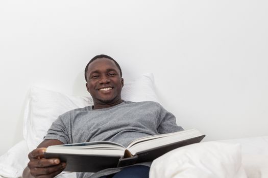 Black man reading a book