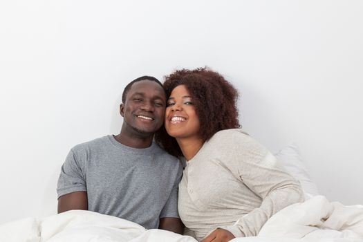 Couple relaxing in bed