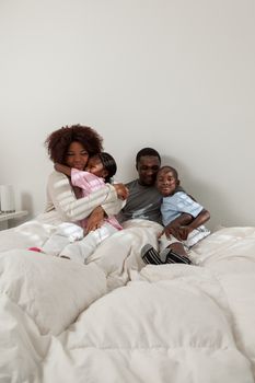 Black family in the bed