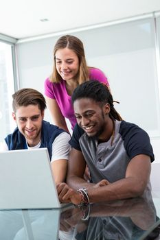 Creative team using laptop in the office