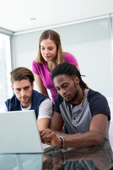 Creative team using laptop in the office