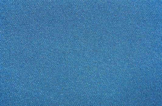 Texture of a blue woven synthetic waterproof fabric                               