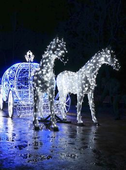 Decorative carriage with horses decorated with lights                                                             