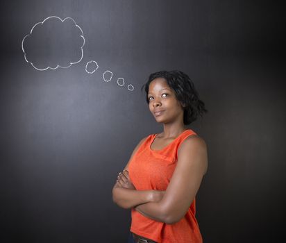 South African or African American woman teacher or student thinking with thought clouds