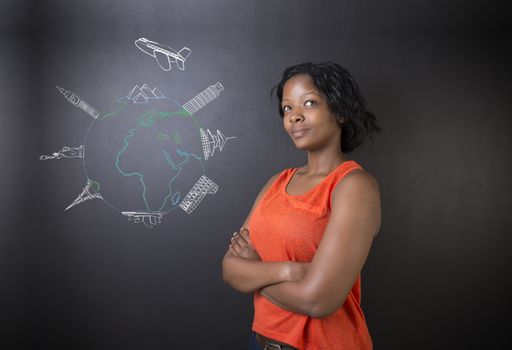 South African or African American woman teacher or student thinking about chalk globe and jet world travel on a blackboard background