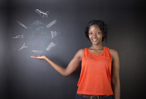 South African or African American woman teacher or student holding her hand out displaying chalk globe and jet world travel on a blackboard background