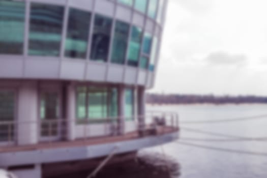blurred floating office building on Dnipro river in Kiev