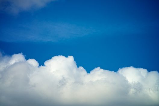 Frame of Fluffy White Clouds on Blue Sunny Sky background Outdoors