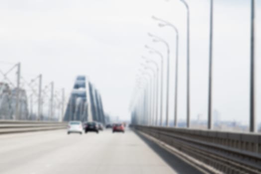 blurred car driving to the horizon on bridge