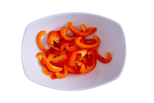 Close up Fresh Sliced Orange Bell Pepper on a White Bowl, Isolated on a White Background.
