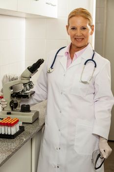 woman looking at the camara in a laboratory