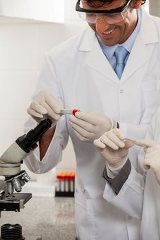 couple looking at the tubes in the lab