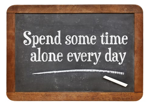 Spend some time alone every day - inspirational words on a vintage slate blackboard