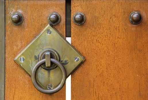 Wooden door with iron elements isolated on white background