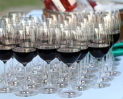 Glass drink red wine in row on table