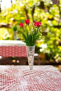  Beautiful flower in a vase on wooden table