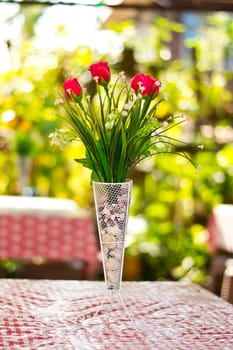  Beautiful flower in a vase on wooden table