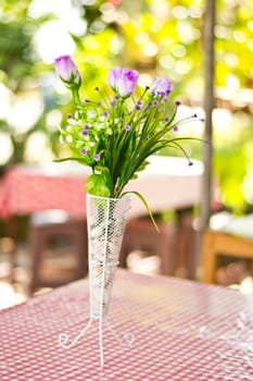  Beautiful flower in a vase on wooden table