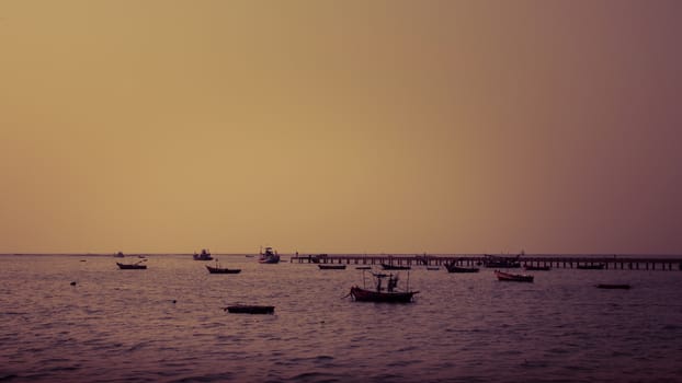 Ship float in sea with jetty in vintage color style