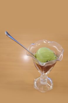 Green tea ice-cream with spoon on table in Japanese style