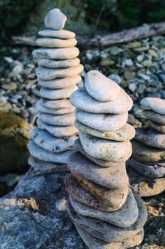 Balancing of stones each other on the seashore