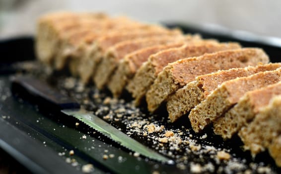 Sliced homemade bread in tray close up shot