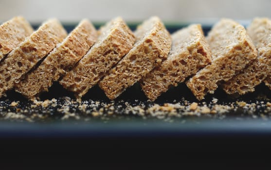 Sliced homemade bread in tray close up shot