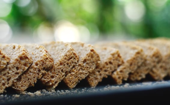 Sliced homemade bread in tray close up shot