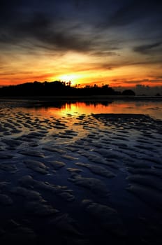 Nice sunset sky and sea at low tide in Payam island, Thailand