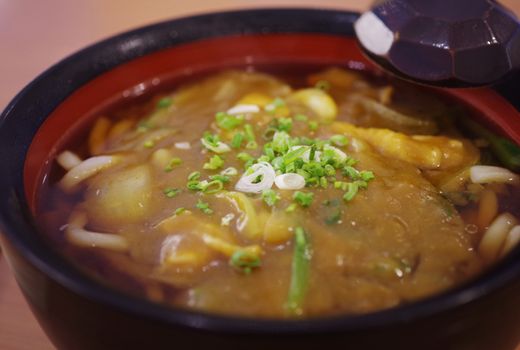 Japanese noodle curry soup on table, Close up shot