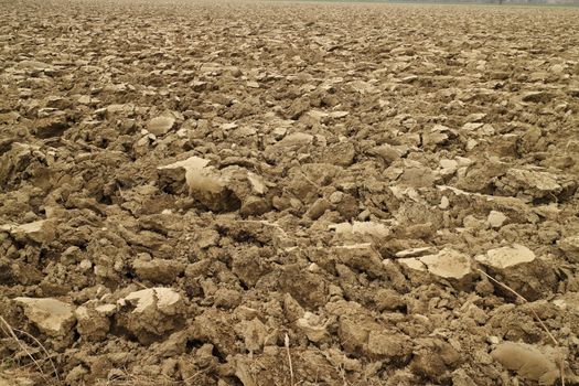 Plowed land near a river in Spring time