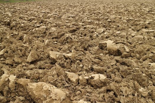 Plowed land near a river in Spring time