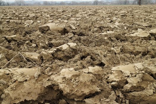 Plowed land near a river in Spring time