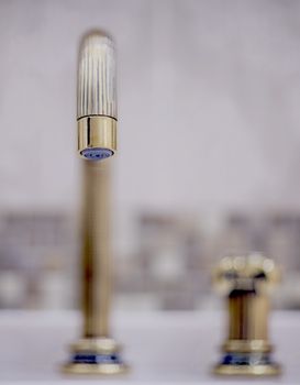 faucet in classic style in bathroom  shallow depth of field