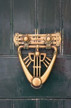 ornamental swing to knock on doors, used as the modern bells