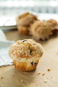 Blueberry muffin on old wooden table