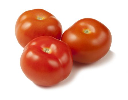 Fresh ripe clean tomatoes on a white background