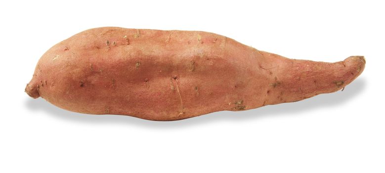 a raw sweet potato on a white background