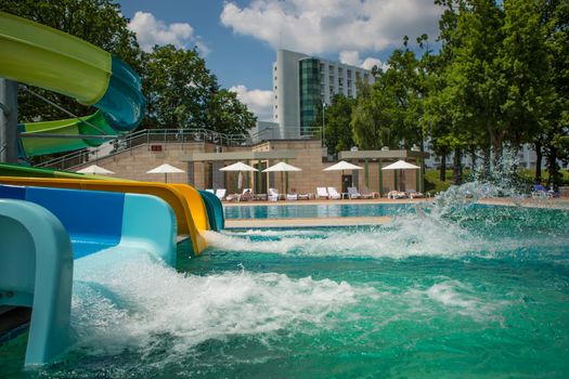 The person riding down a water slide