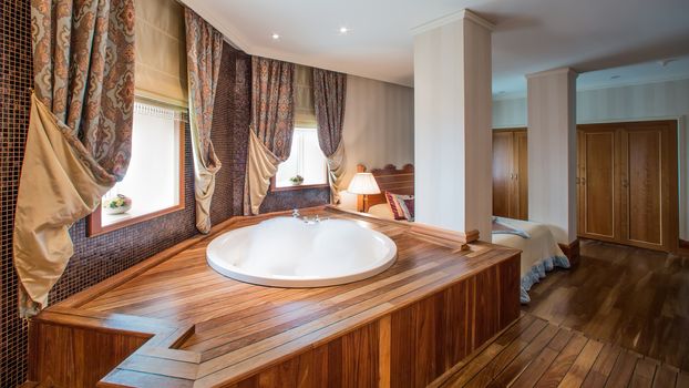 luxury bathroom interior complete with granite and beautiful tiled floors and walls.