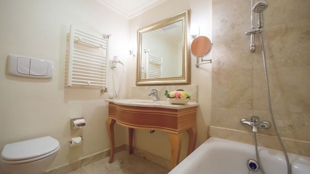 luxury bathroom interior complete with granite and beautiful tiled floors and walls.