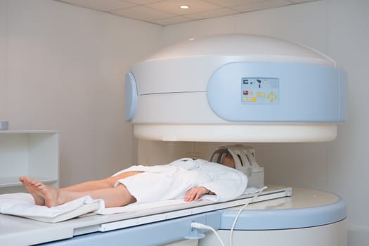 Young woman having an Magnetic resonance imaging